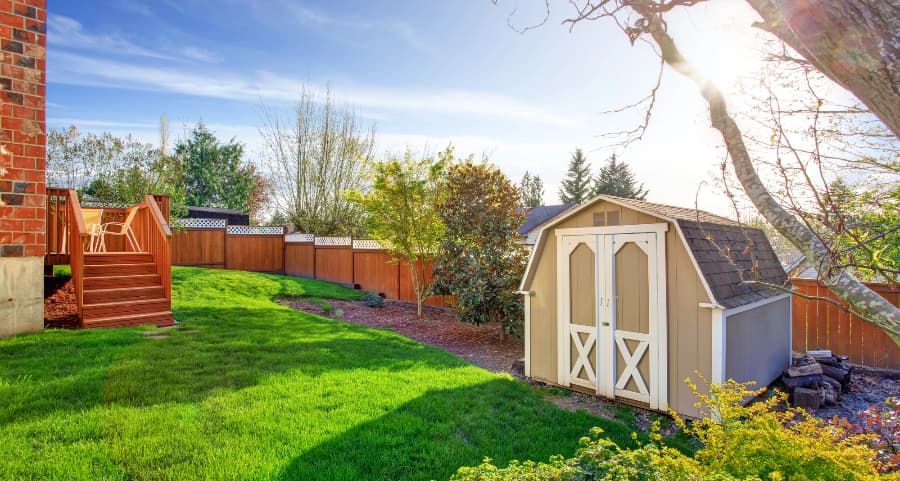 Fenced backyard with storage shed in Sandy Springs